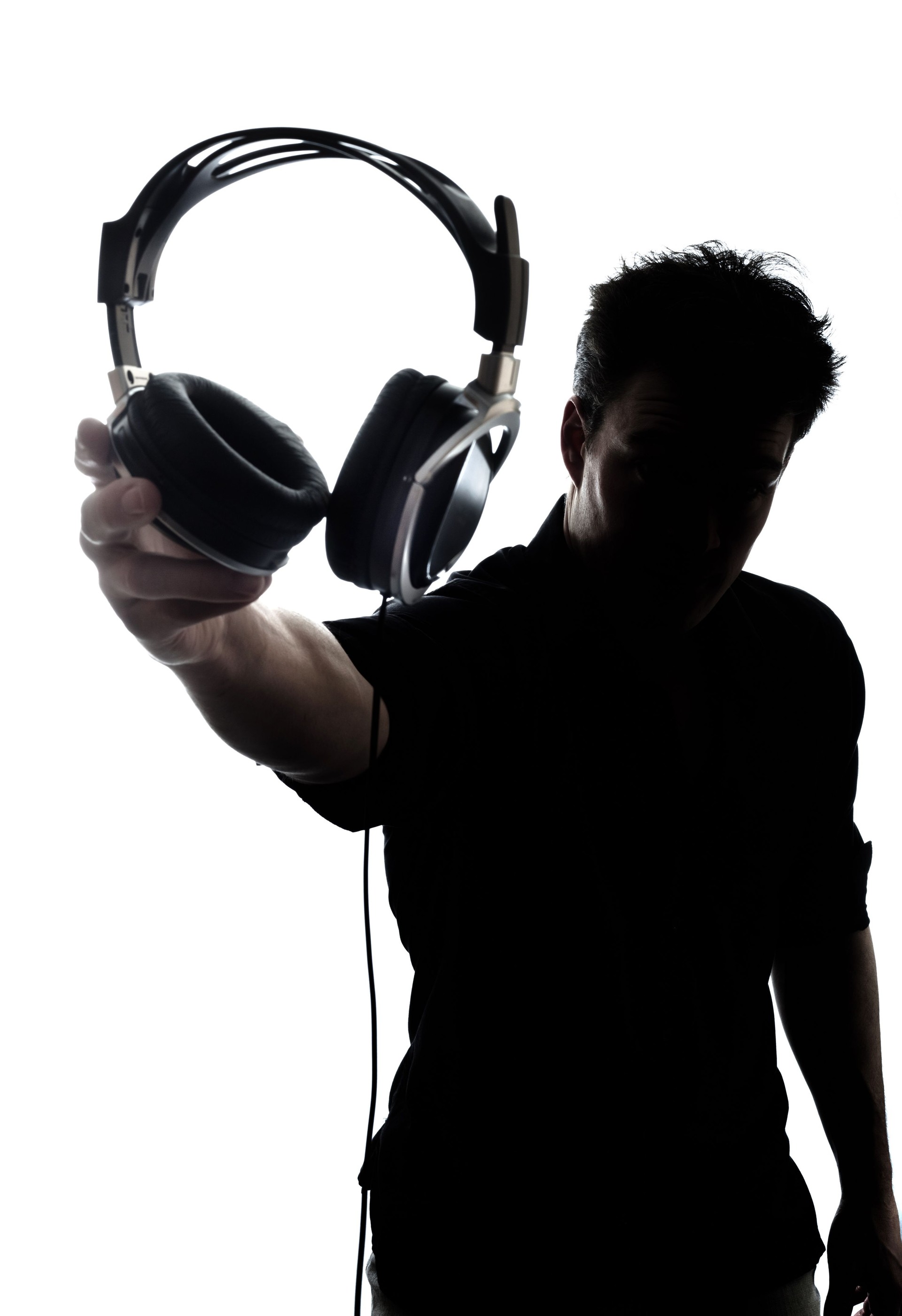 Male in silhouette showing headphones